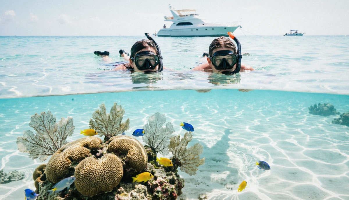 Snorkelers over a shallow reef off Isla Mujeres on Cancun yacht rentals